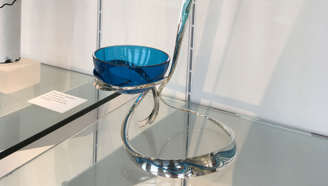blue silver holder for a blue glass bowl