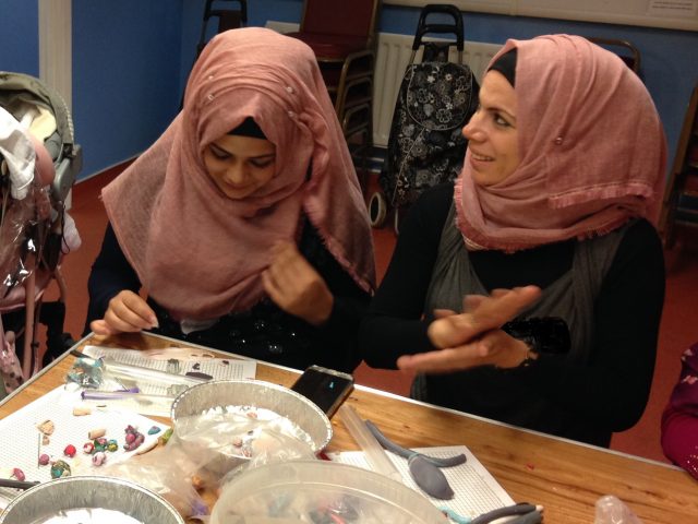 The refugee action group is forming the pearls for the jewellery.