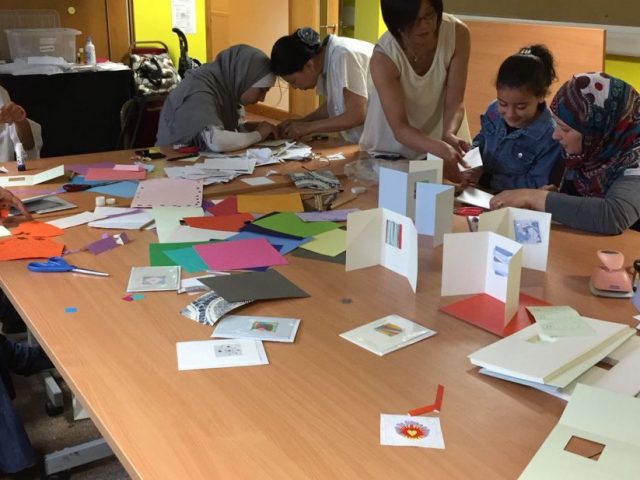 Refugee Action clients and Shelanu members making cards