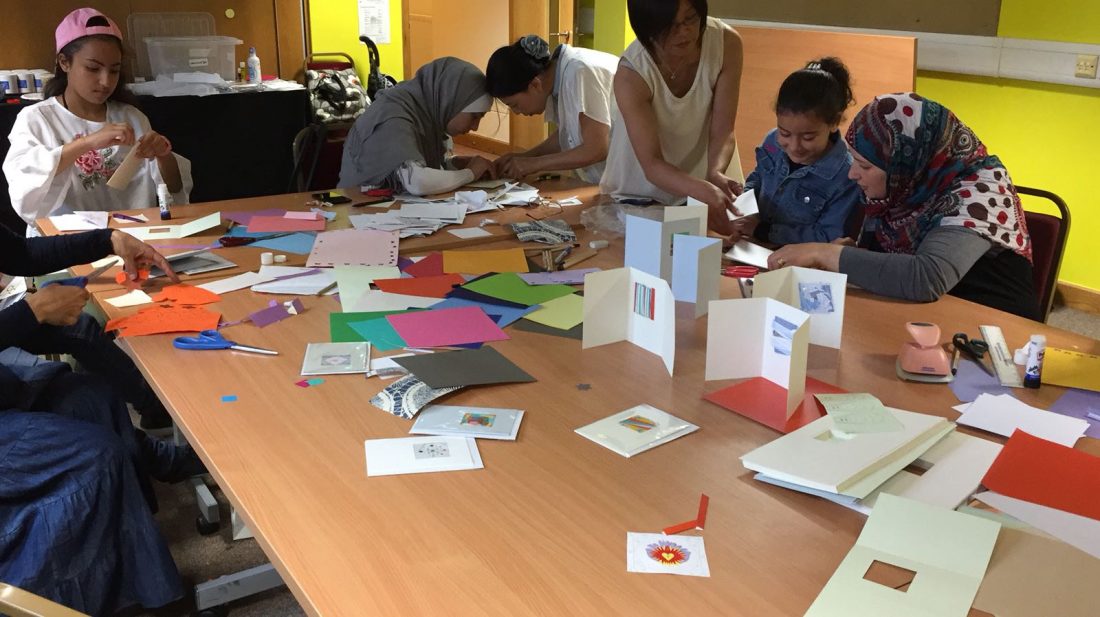 Refugee Action clients and Shelanu members making cards
