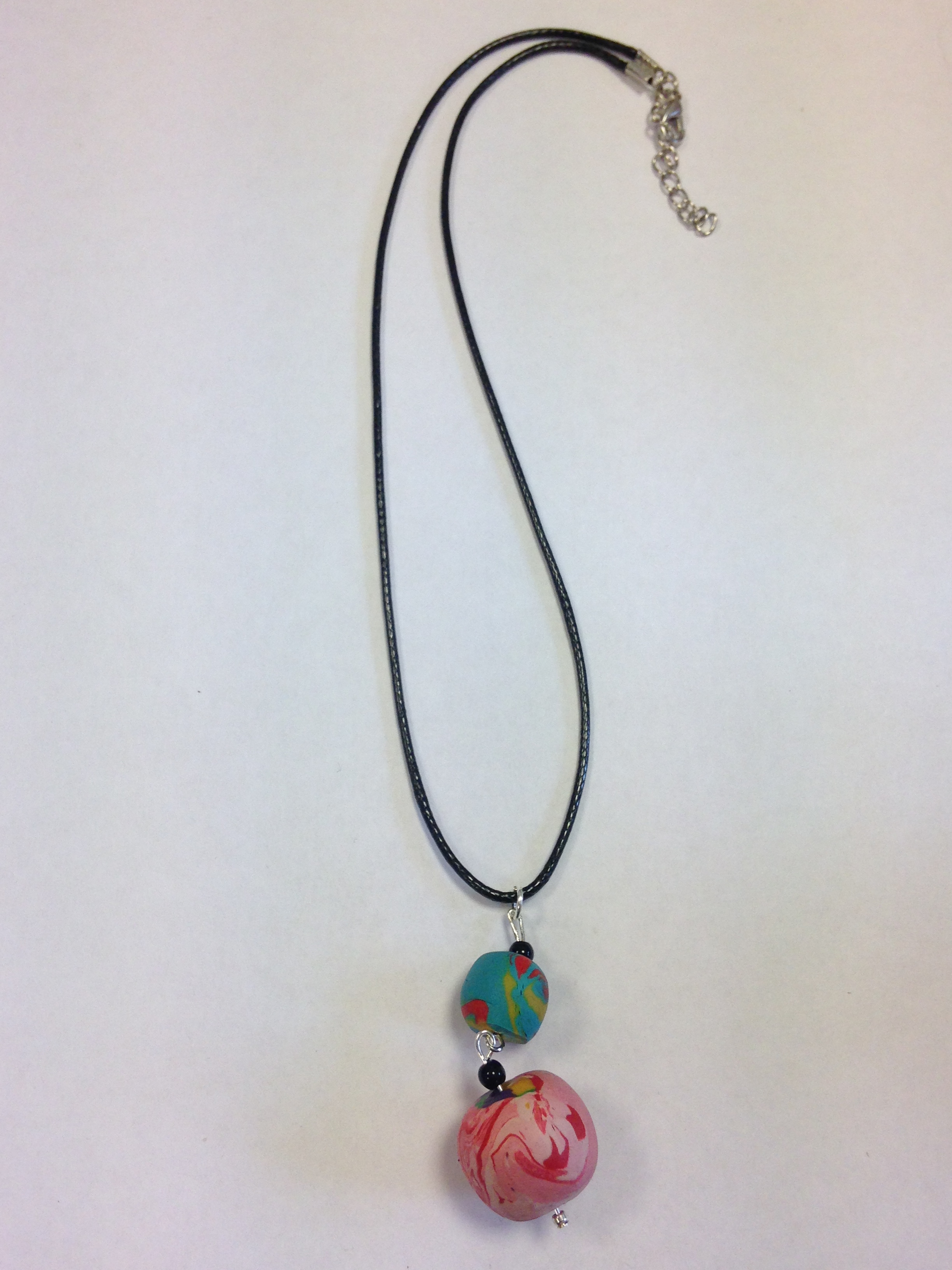 polymer clay necklace with two balls in different colours as pendant
