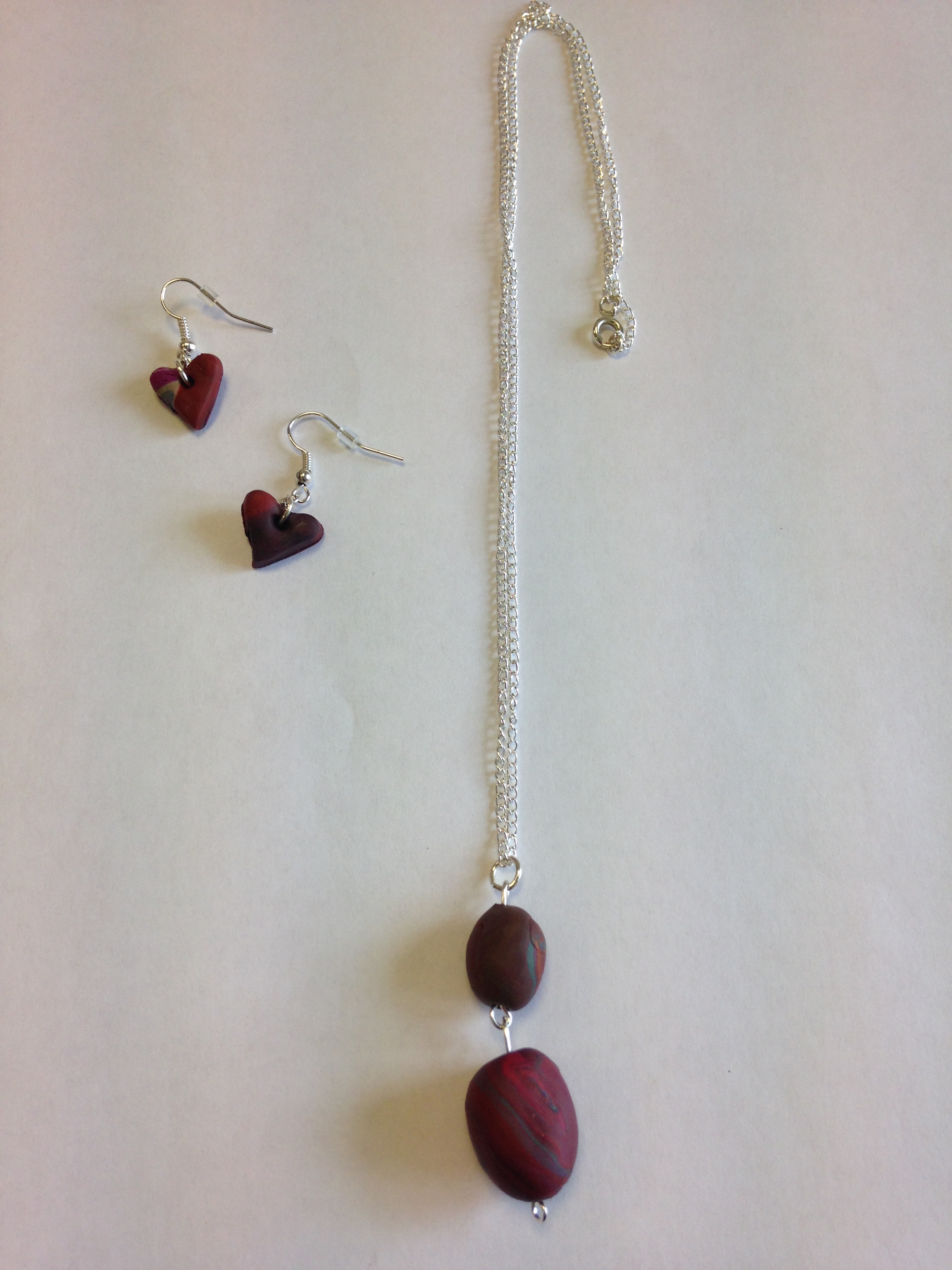 necklace with dark red polymer clay pieces and earrings as a shape of hearts
