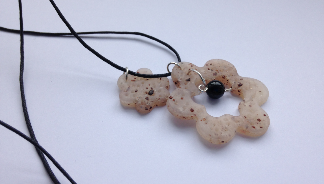 necklace with polymer clay pendant with spices in the clay